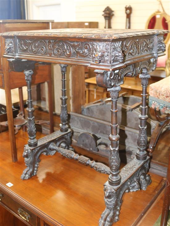 A Flemish carved oak sewing table, W.59cm